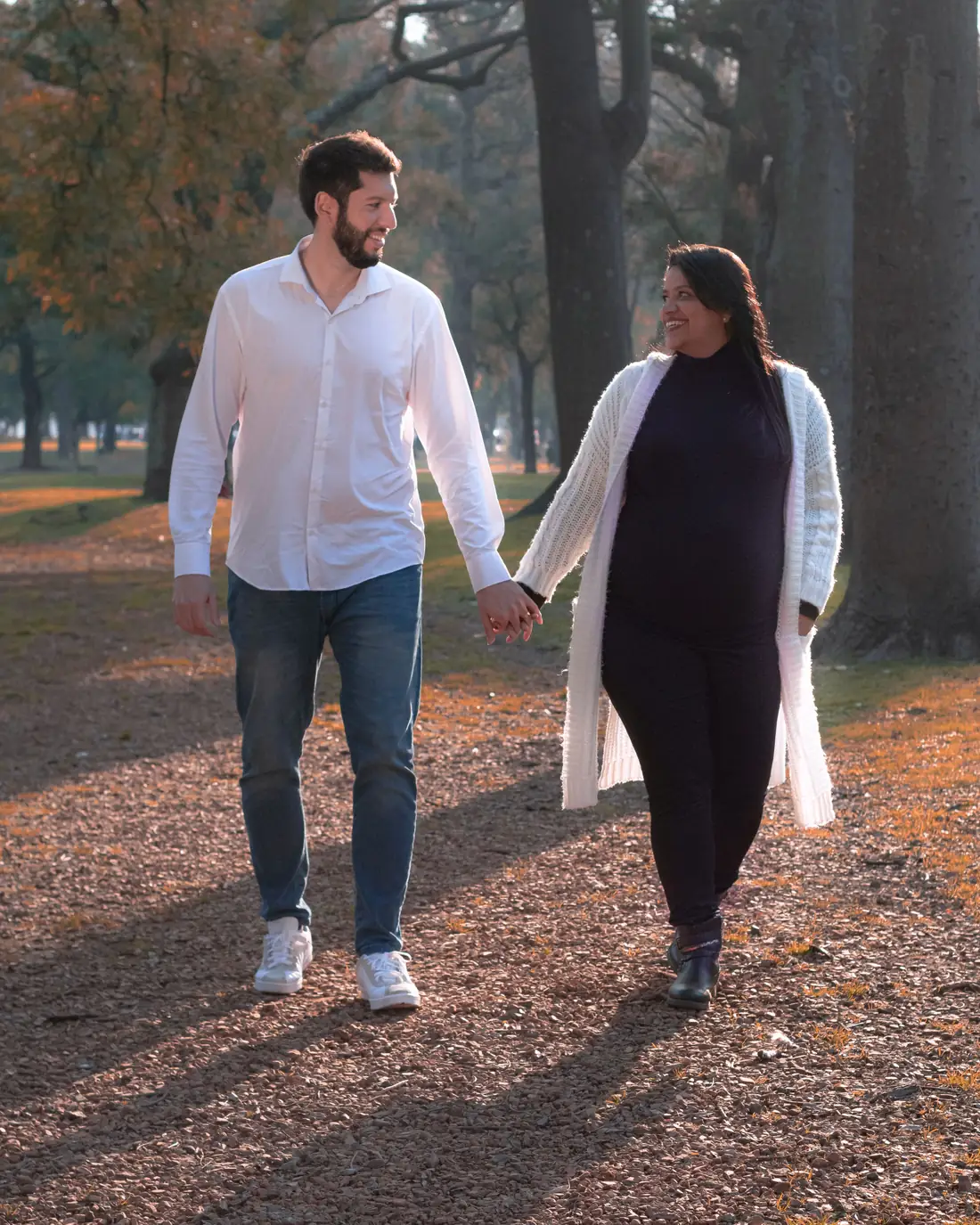 Illustrative stock photo of a couple walking together in a California park, not real members